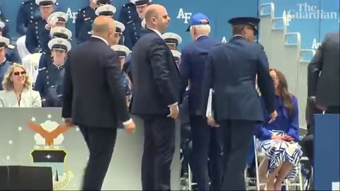 Joe Biden falls on stage at US air force academy ceremony