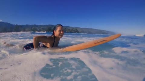 Tulsi Gabbard surfing