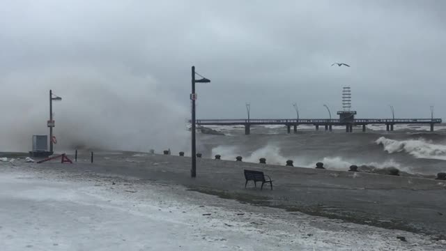 Massive waves pound the shoreline at Spencer Smith Park in Burlington during freezing rain storm