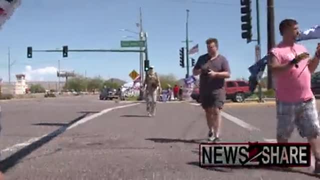 Several armed patriots gathered outside the FBI building in Phoenix, Arizona.