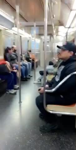 Man green jacket eating spaghetti out of bag