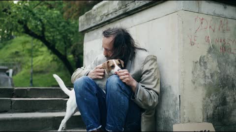 sad dog with owner