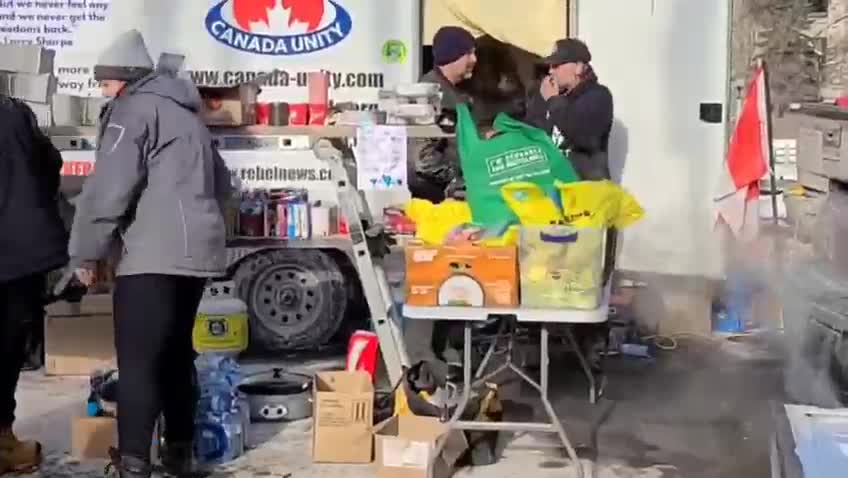 Participants of the Truckers Convoy 2022 preparing meals for the homeless in Ottawa Canada