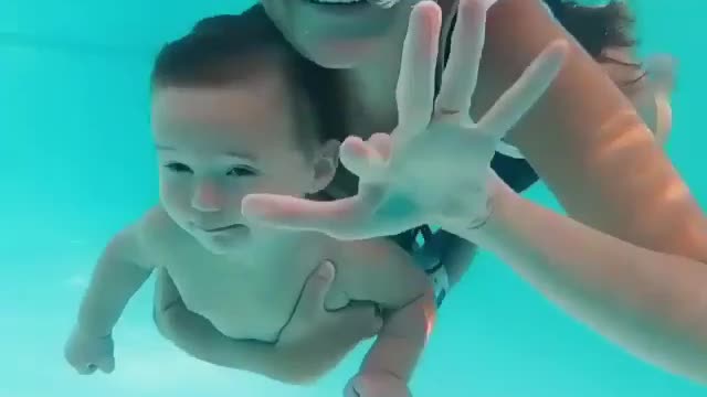 baby learning to swim how cute