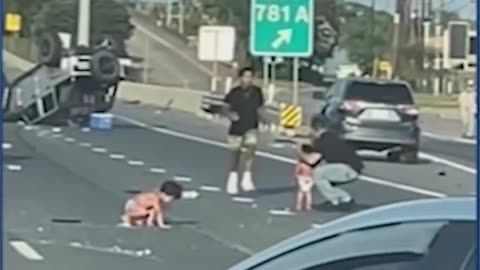 Two kids in diapers rolling on the freeway