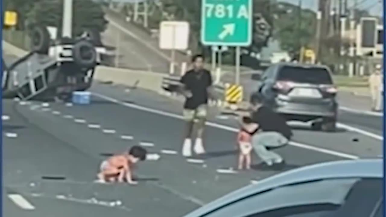 Two kids in diapers rolling on the freeway