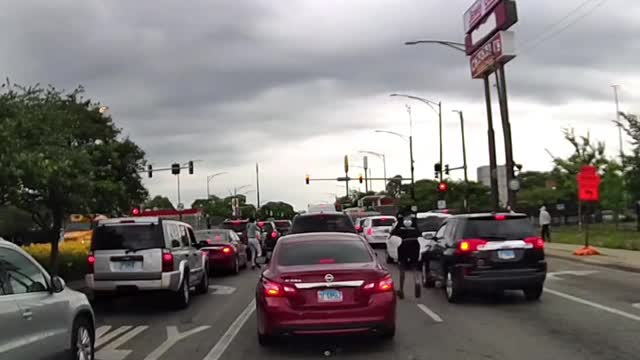 DASHCAM: Chicago Thugs With Automatic Rifle Open Fire In Traffic