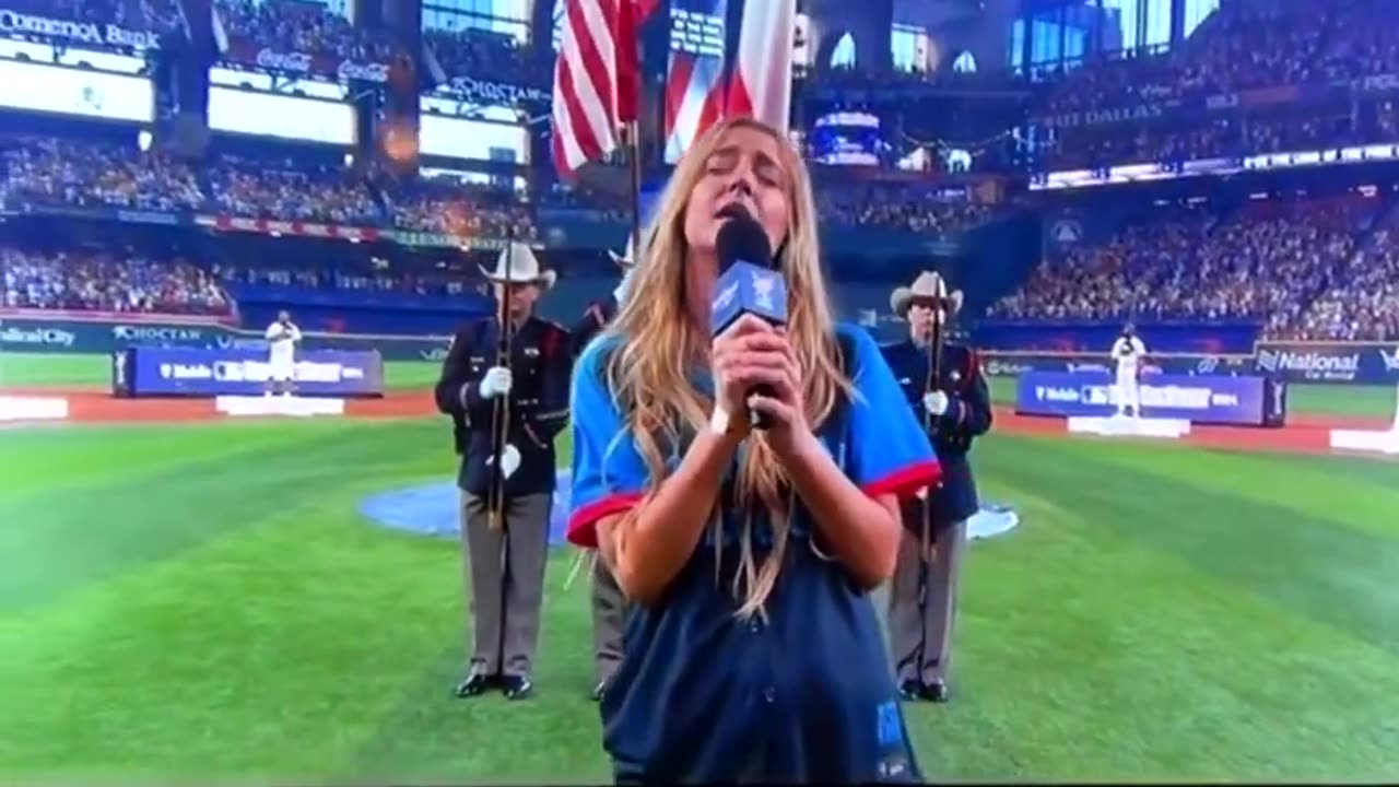 Ingrid Andress signing the national anthem at the home run derby