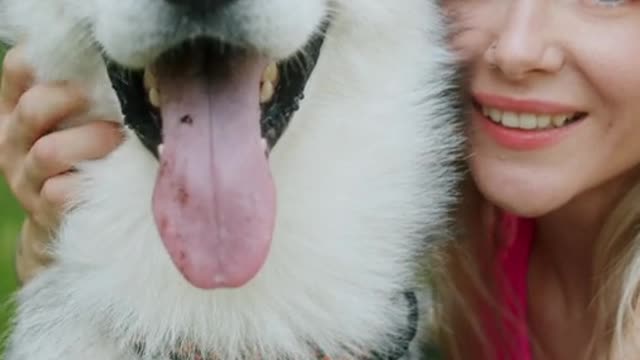 a woman petting her dog