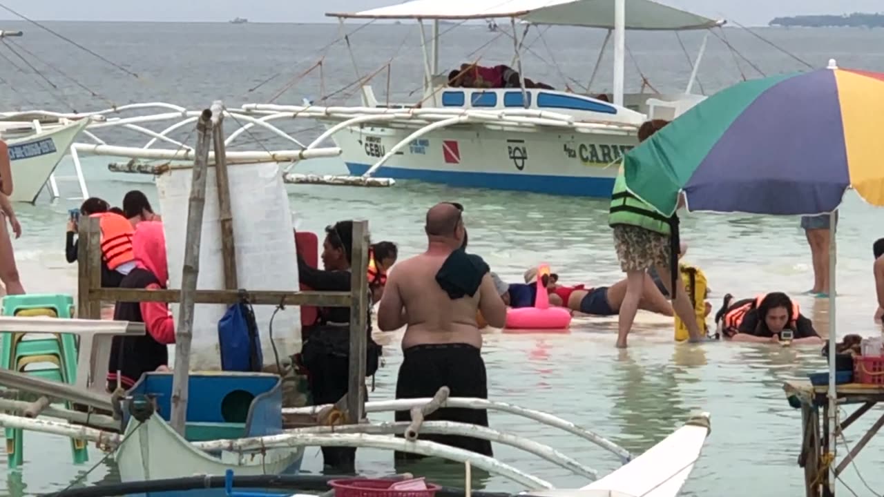 Tourist crowding a famous sandbar in Bohol Philippines