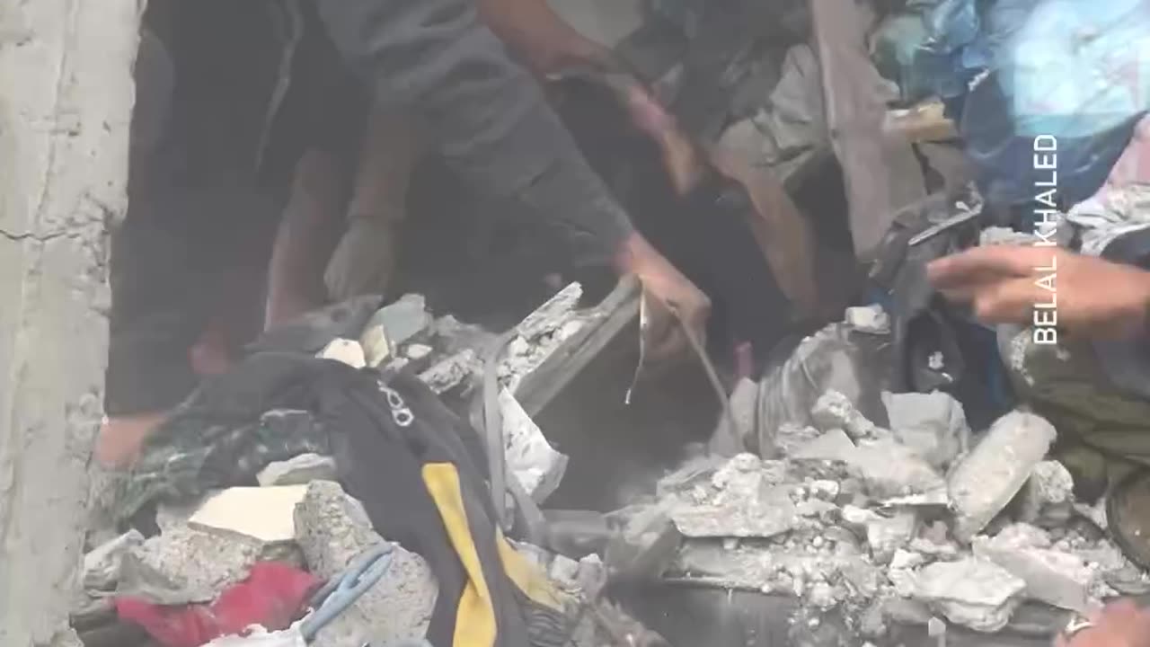 Palestinians rescue girls from the rubble of a destroyed home in Khan Younis city, southern Gaza.