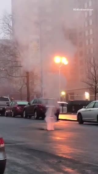 Fire and fireworks inside sewer hole in street