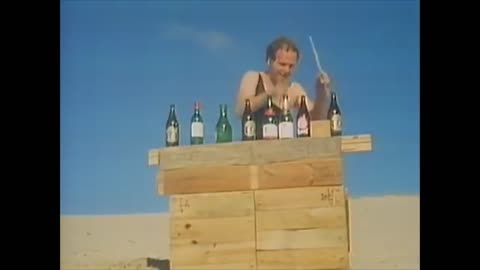 land down under except there's no music and it's just the dude with the bottles