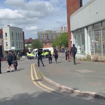police Allow a group of Muslims to run past with weapons