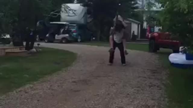 Jousting while riding on friends back using beer cans and boxes as armor