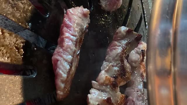 Beef grilling sound and turning video