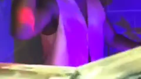 Music guy waving fists in air and dancing