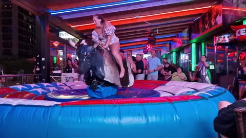 😱 OMG! Pretty Girl Fails at Mechanical Bull Ride in Benidorm | Spain 2024