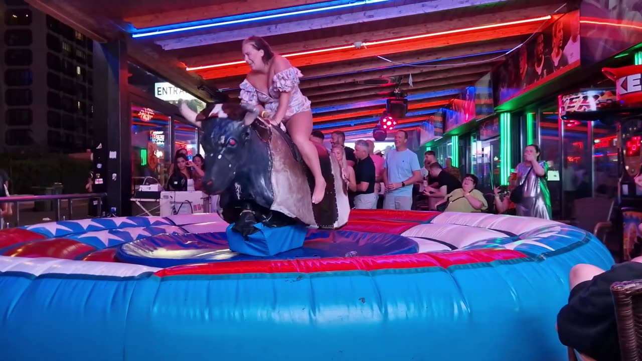 😱 OMG! Pretty Girl Fails at Mechanical Bull Ride in Benidorm | Spain 2024