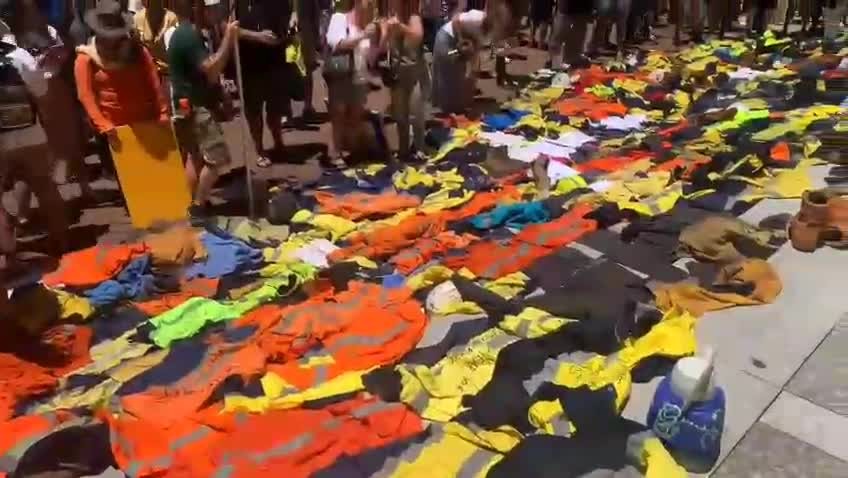 Powerful scenes of Patriots in Australia laying down their work uniforms