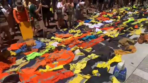 Powerful scenes of Patriots in Australia laying down their work uniforms