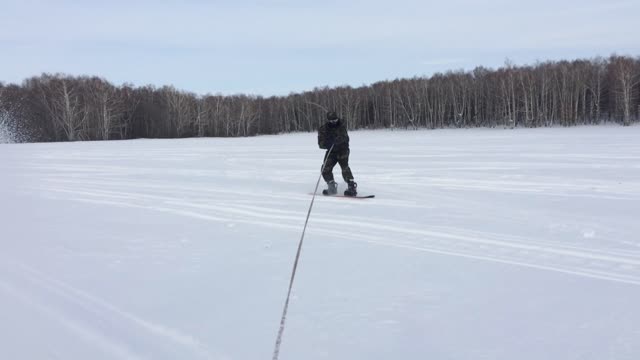 snowmobile and snowboard ride