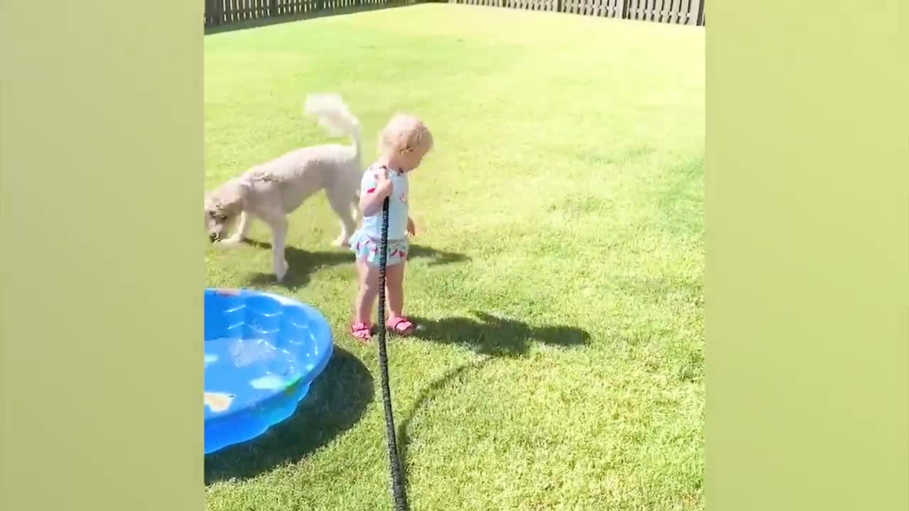 Funny baby playing with water