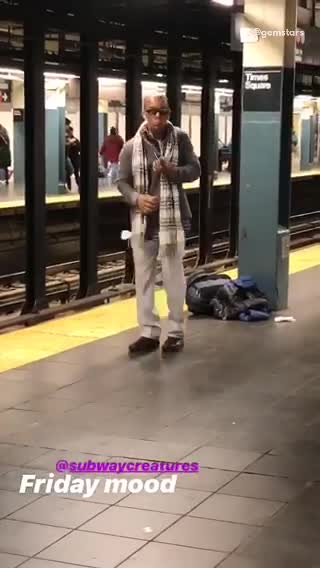 Man sunglasses scarf dancing subway train platform