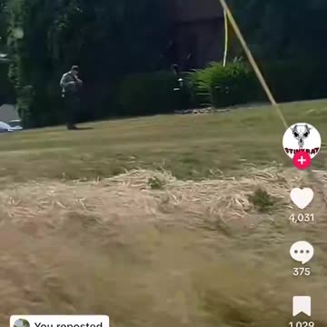 Shooter caught on video walking while being followed by an officer.