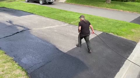 Professional Asphalt Spray Sealing: “The Little Pole One” Top Coats Pavement Maintenance