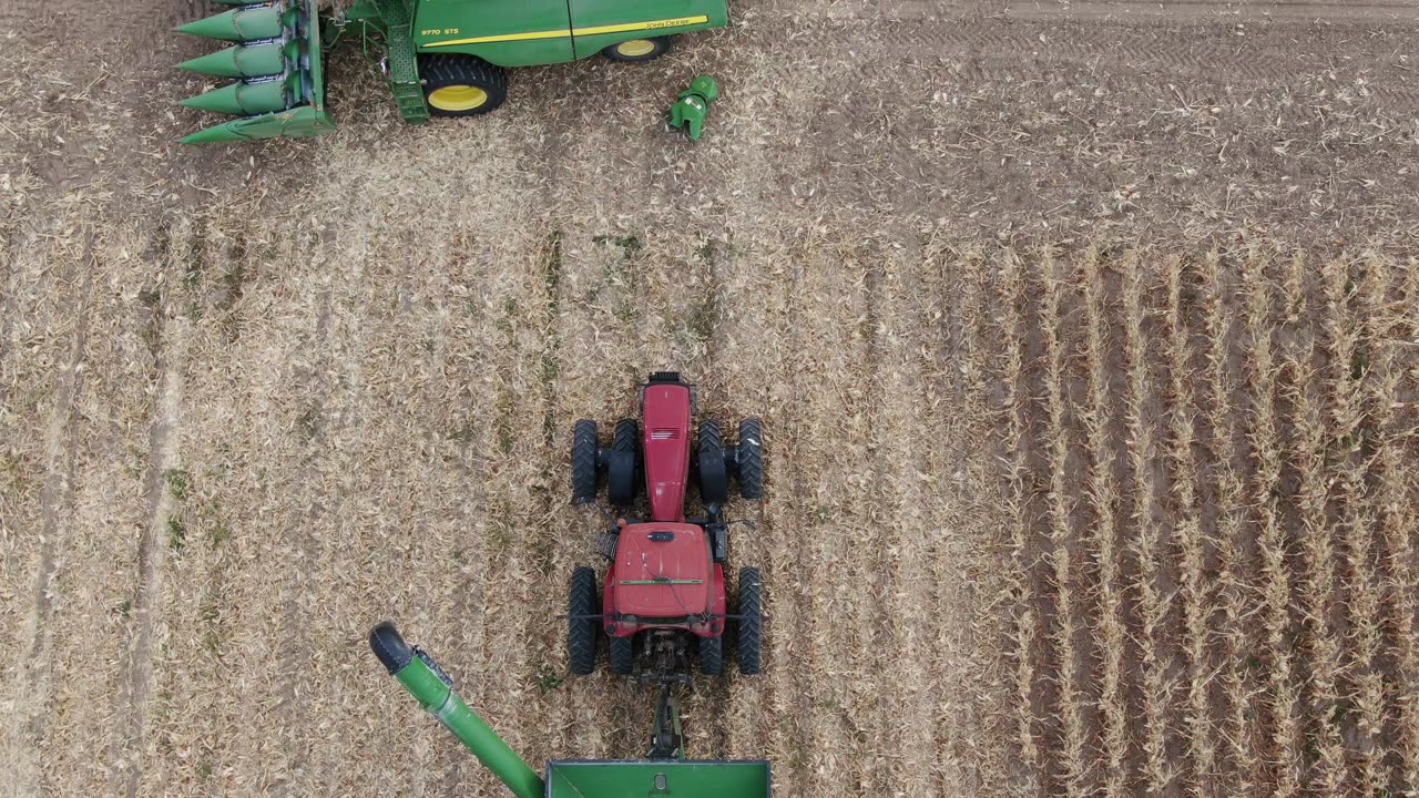 Pan up over grain cart to Monument