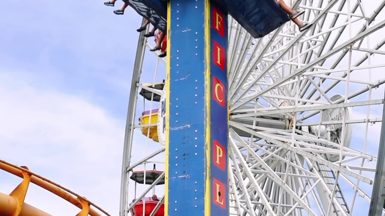 A Free Fall Amusement Ride In An Amusement Park