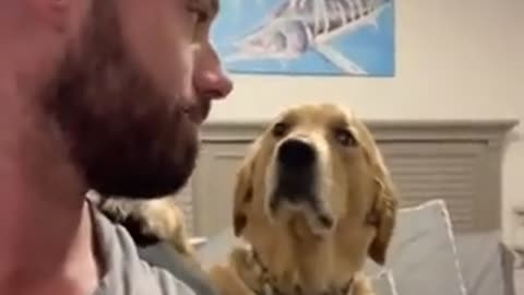 Kissing his dog on the head and seeing his reaction 😭