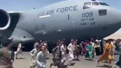 Afghans Trying To Escape The Taliban Hold On To Plane and Splatter On Roofs Of Buildings