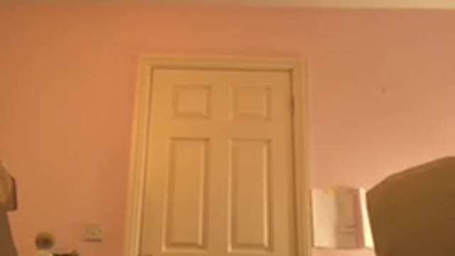 Girl does a handstand against her bedroom door and accidentally kicks over her picture frame