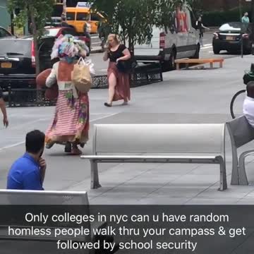 Security following colorful homeless person floral feathers