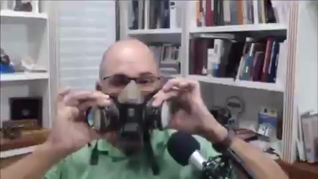 Doctor shows why masks don't work.