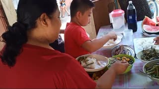 Eating outdoor with family.