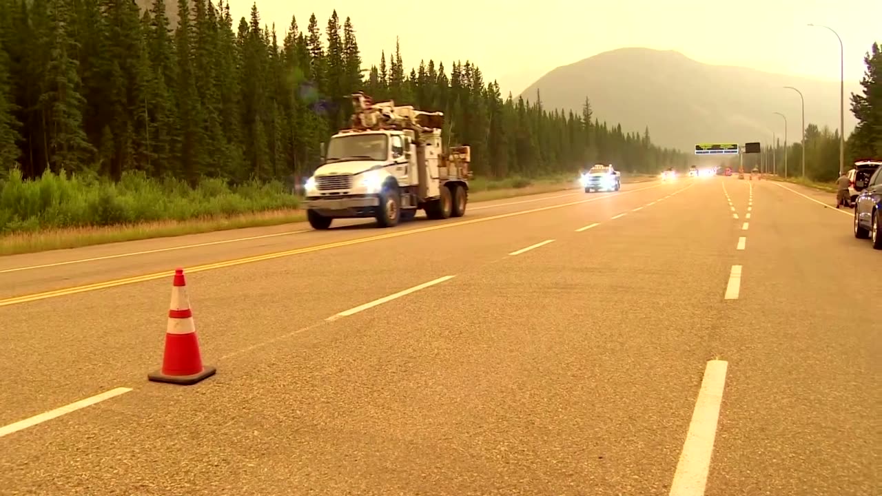 Alberta premier holds back tears as wildfire rages