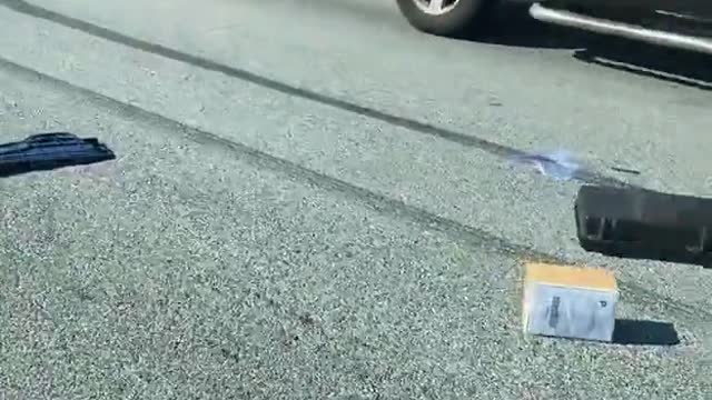 Cop Car Spills Contents into Street