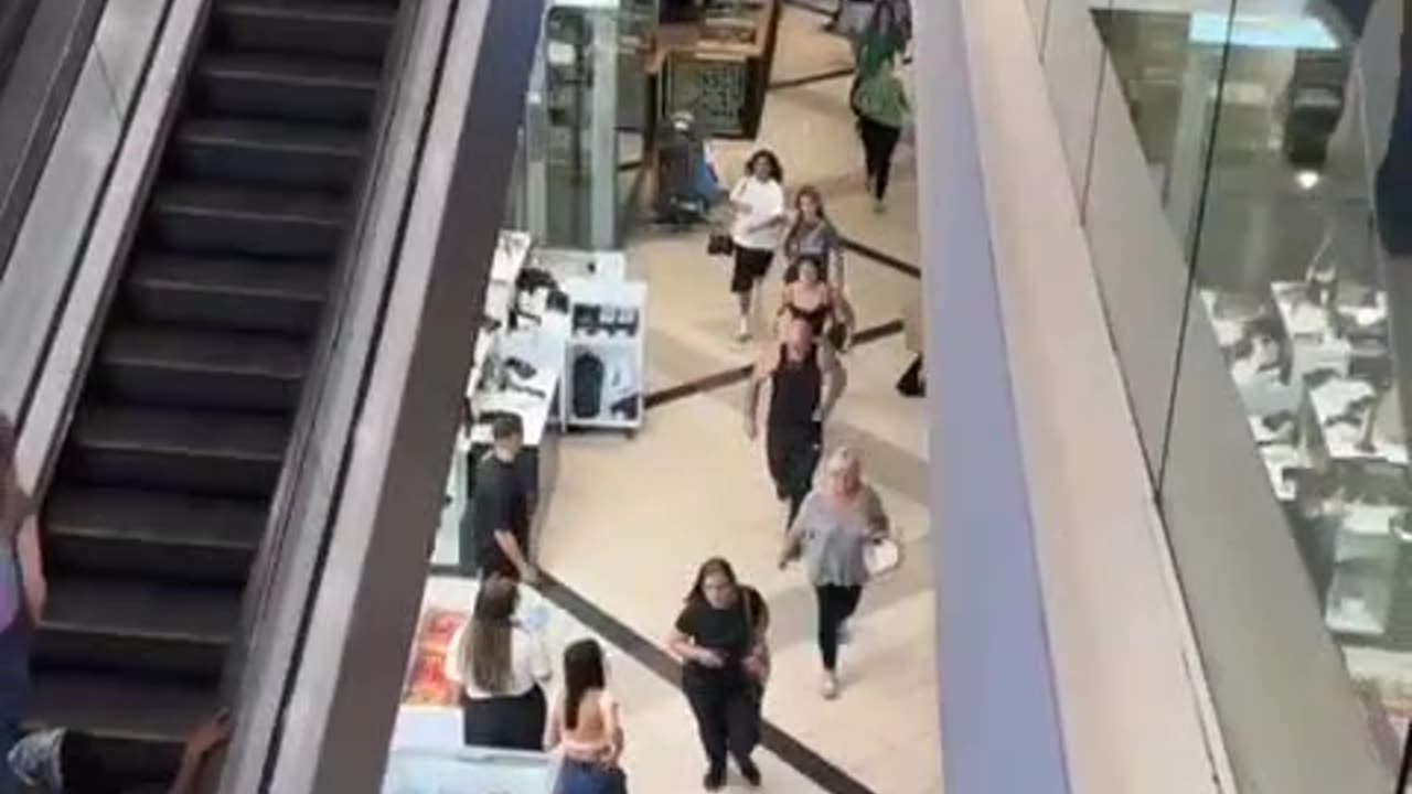 Settlers take shelter in a shopping mall as Yemeni forces carry out airstrikes on Tel Aviv