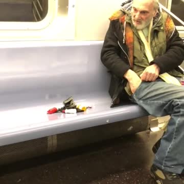Old man empties his pockets and puts pills on subway seat
