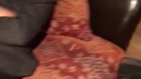 Guy recording slapping two of his sleeping friends in red pillows
