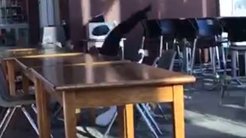 Girl running on top of table in library