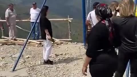 A huge swing above the cliff suddenly breaks the chain