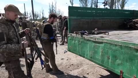 Ukraine War - Azov militants handing over weapons to Russian forces