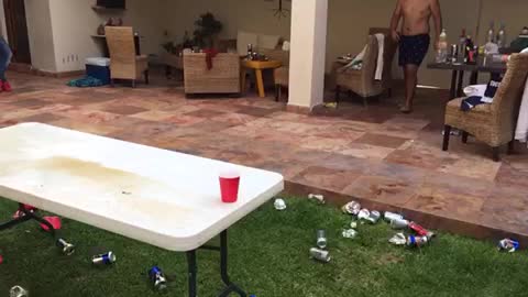 Beer pong dunk outside black and white shorts no shirt