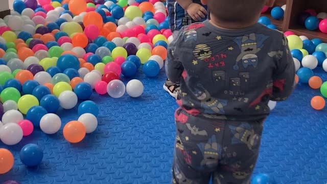 Two funny kids dancing at the ball house