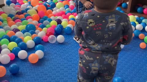 Two funny kids dancing at the ball house