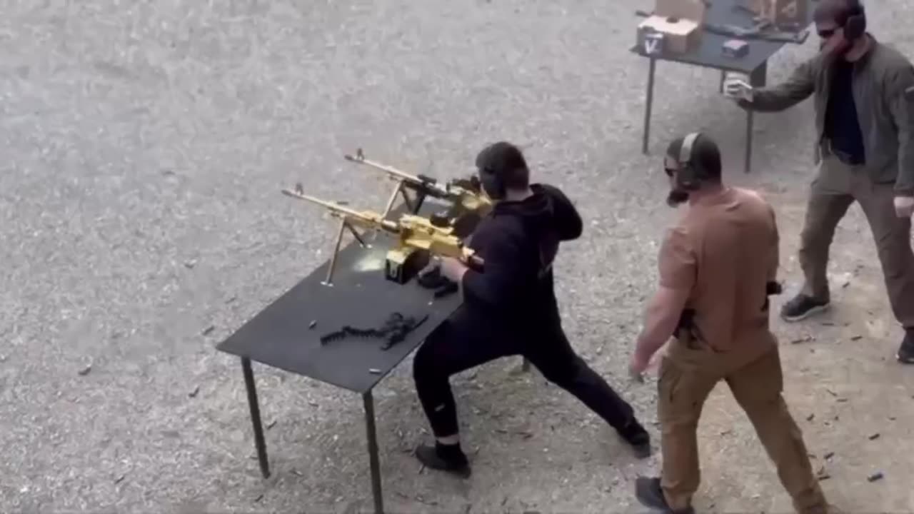 Chechen leader Kadyrov's son Adam fires two gold-plated machine guns.